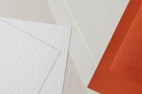 Kaboompics - Beige White and Orange Layered Paper Texture