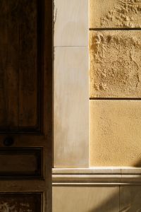Kaboompics - Sunlit Warm Wall and Wooden Door Detail