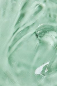 Kaboompics - Transparent Gel Texture with Air Bubbles on Green Background