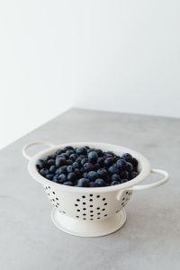 Kaboompics - Close-Up of Fresh Blueberries in White Colander