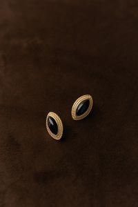 Kaboompics - Gold Oval Earrings on Brown Background