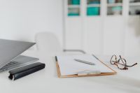 Kaboompics - Empty Medical Desk With Clipboard and Glasses