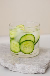 Kaboompics - Cucumber Lime Water on a Stone Coaster