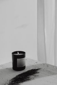 Kaboompics - Black Candle Styled on a Stone Ledge With Dried Branch