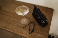 Kaboompics - Two Martini Glasses with Green Olives and Shadows