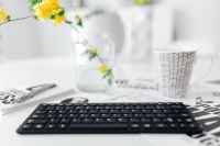 Kaboompics - Female hands typing on the remote wireless computer keyboard
