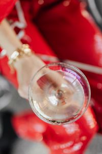 Kaboompics - Champagne Coupe and Red Sequin Outfit Detail with White Top