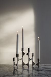 Kaboompics - Chrome Candelabra with Lit Candles on Arabescato Marble
