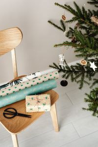 Kaboompics - Gift Wrapping Supplies on Wooden Chair beside Tree