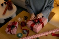 Kaboompics - Overhead Christmas Gift Wrapping with Red Ribbon