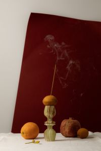 Kaboompics - Incense Smoke Rising over Citrus and Pomegranate Still Life
