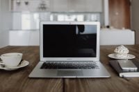 Kaboompics - Silver Apple MacBook Pro with a coffee, smartphone and a notebook on a table