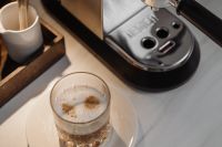 Kaboompics - Overhead Layered Coffee Glass and Espresso Machine