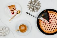 Kaboompics - Christmas Blueberry Pie and Cappuccino with Two Silver Snowflake Ornaments