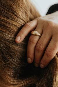 Kaboompics - Woman's Hand in Hair Showing Gold Ring