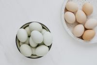 Kaboompics - Easter flat lay with green eggs on a white marble