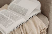 Kaboompics - Horizontal Close-Up of an Open Book on Beige Upholstery