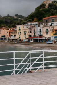 Kaboompics - Soft-Focus Marina di Puolo Shore Seen Past a White Pier Railing