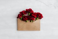 Kaboompics - Red Carnation Envelope with White Marble Copy Space