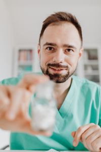 Kaboompics - Medicine Bottle in Focus Before Doctor