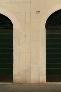 Kaboompics - Stone Arch Facade with Green Shutters and House Number, Brescia