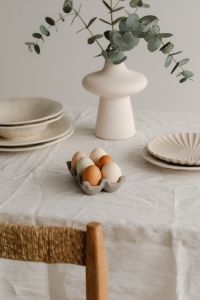 Kaboompics - Neutral Easter Table With Pastel Eggs And Ceramic Plates