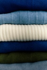 Kaboompics - Folded Blue, Cream and Green Knitwear for Seasonal Color Palette