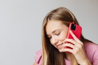 Kaboompics - Girl Checking Smartphone with School Notebook