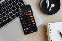 Kaboompics - Phone - stock exchange - charts - AirPods - laptop