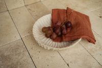 Kaboompics - Red Grapes and Rust Napkin on Stone Floor