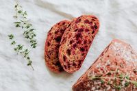 Kaboompics - Sliced Beetroot Bread with Thyme on White Linen