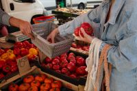 Kaboompics - Woman Holding a Tomato while Grocery Shopping