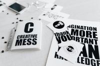 Kaboompics - Top View of Black and White Typography Cards and Notebook