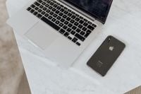 Kaboompics - Angled Laptop and Smartphone on Marble Table Workspace