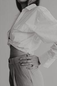 Kaboompics - Black and White Side View of White Shirt and Beige Trousers