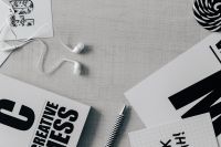 Kaboompics - Close-Up of Typography Cards with Earphones and Pen