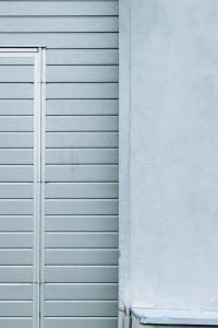 Kaboompics - Blue Slatted Wall with White Door