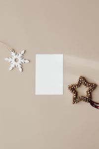 Kaboompics - Neutral Holiday Card Mockup with Snowflake and Gold Star Ornament