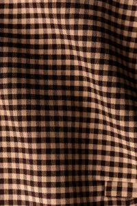 Kaboompics - Brown Check Fabric Draped – Gingham Textile in Motion