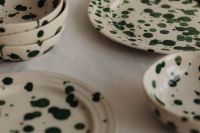 Kaboompics - Green Splatter Bowls and Plates in a Soft Focus Tableware Scene