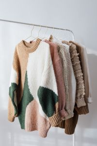 Kaboompics - Sweaters on a hanger