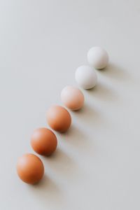 Kaboompics - White and Brown Eggs in a Descending Diagonal with Copy Space, Easter Background