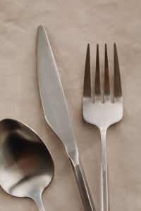 Kaboompics - Minimal Knife and Fork Still Life on Beige Background