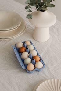 Kaboompics - Overhead Easter Table With Blue Egg Carton And Ceramic Vase