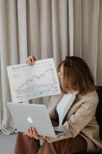Kaboompics - Overhead Portrait of Woman Reviewing a Financial Graph
