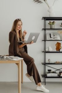 Kaboompics - Female Interior Designer Having a Video Call on Laptop in Studio