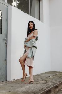 Kaboompics - Full Body Asian Fashion Model in Pale Dress with Gray Jacket on Concrete Steps