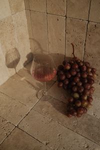 Kaboompics - Wine Glass and Red Grapes in Travertine Corner