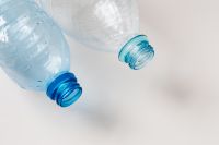 Kaboompics - Macro Close-Up of Clear Plastic Bottles with Blue Threads and Water Droplets