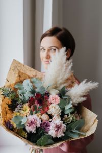 Kaboompics - Portrait of Woman Partly Hidden by Pampas Grass